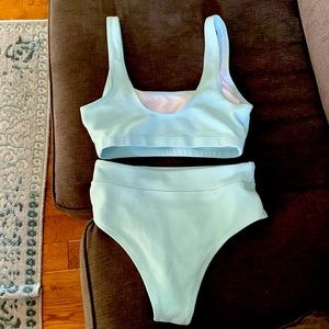 Sea foam 2 pcs bathing suit brand new . Patted breast area .